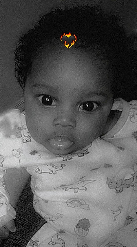 Lani is registered to the contest to win money with this photo: baby, black, cheek, child, chin, eye, eyebrow, eyelash, flash_photography, forehead, hairstyle, happy, head, iris, lip, nose, organ, person, skin, style