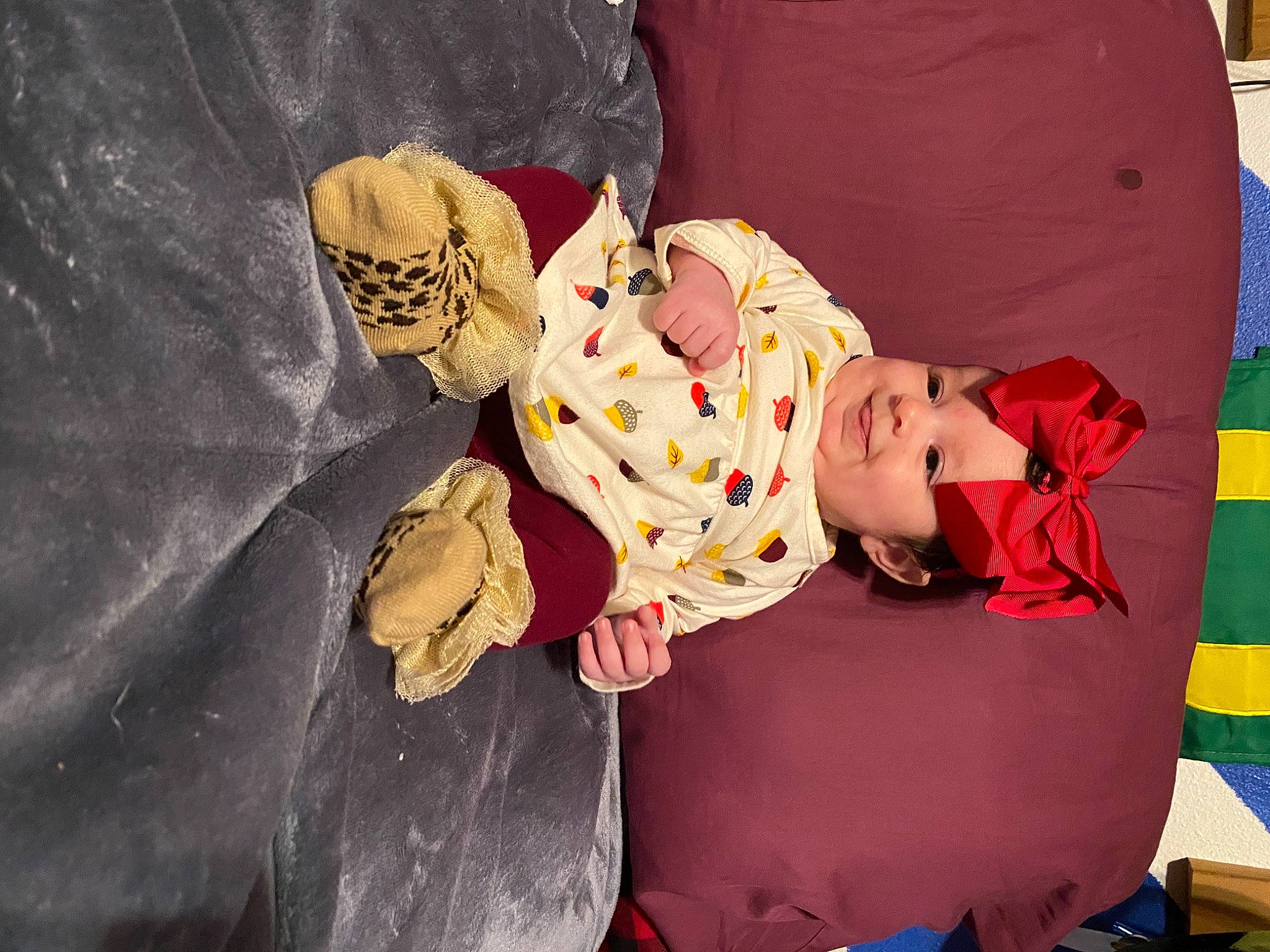 Addison is registered to the contest to win money with this photo: child, comfort, costume, doll, dress, fun, happy, hat, headgear, headwear, human_body, joy, leisure, linens, magenta, person, plant, room, sitting, teddy_bear