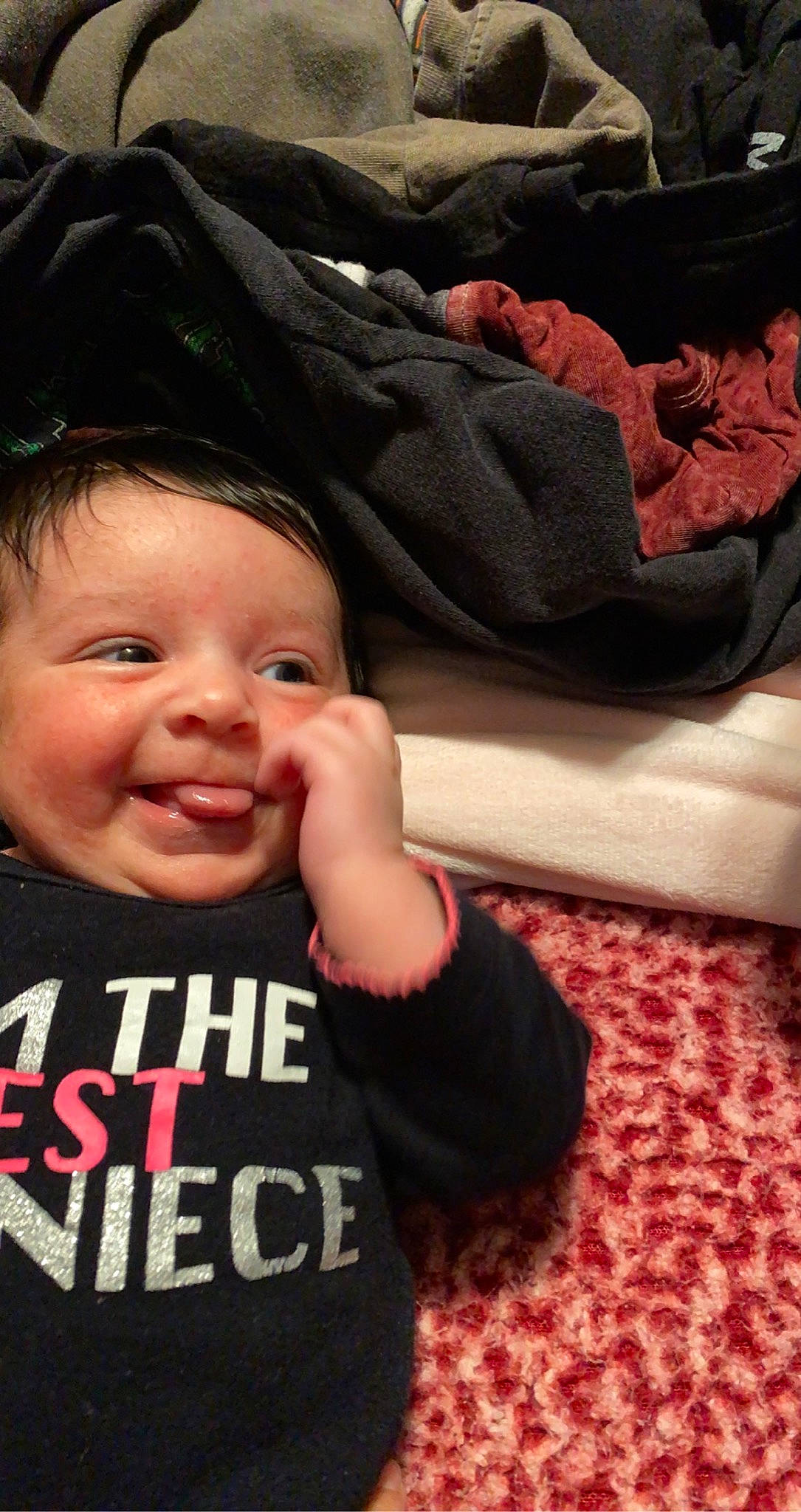 Addison is registered to the contest to win money with this photo: baby, cheek, child, comfort, cool, eye, eyebrow, face, finger, gesture, happy, lip, mouth, nose, outerwear, person, skin, sleeve, smile, textile