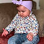 Andréa participe au concours pour gagner de l'argent avec cette photo : baby, barefoot, casual_clothing, child, couch, curly_hair, cute, floral_shirt, focused, headband, home, indoor, infant, jeans, pink_blanket, portrait, seated, small_feet, small_hands, soft_lighting