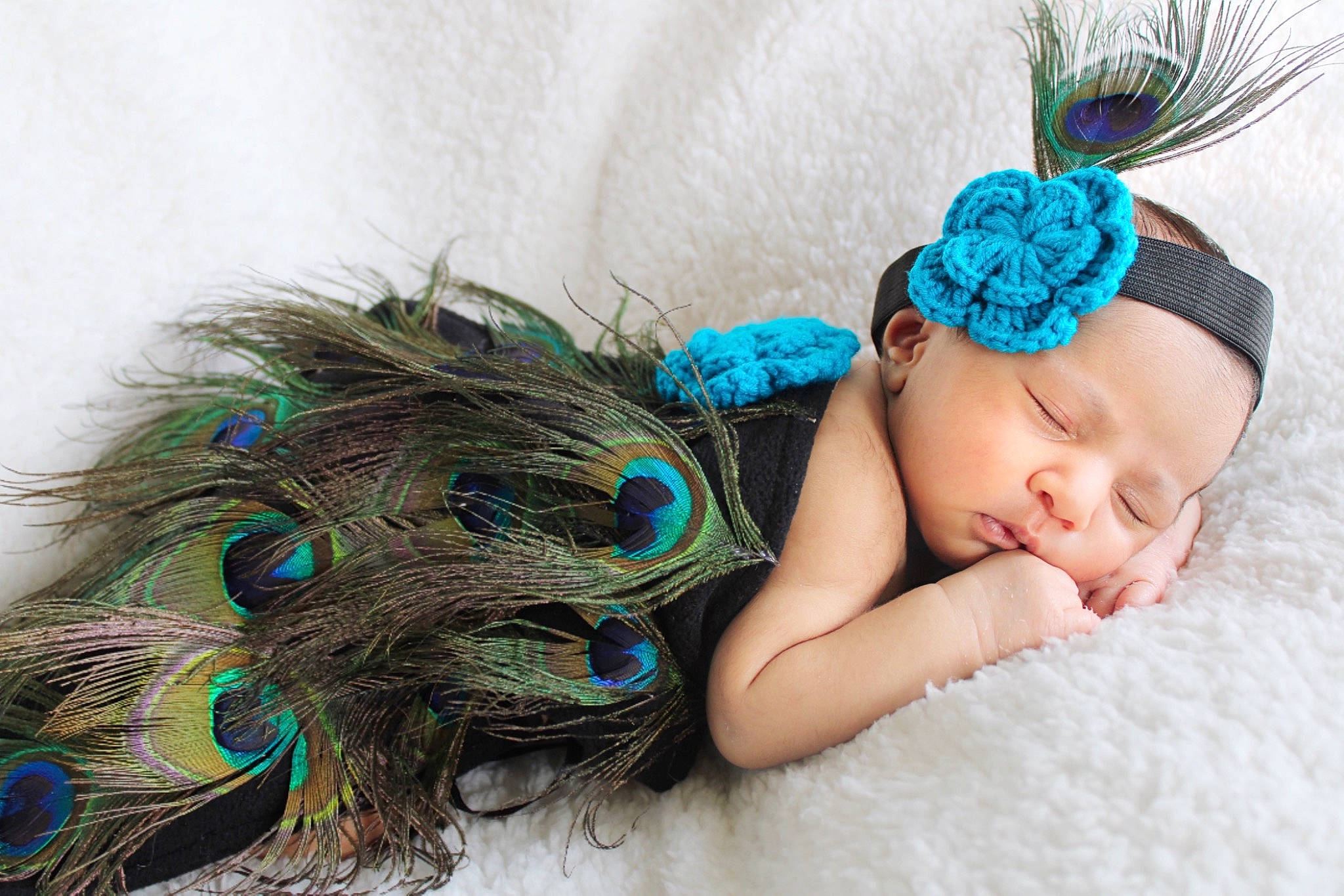 Varalika is registered to the contest to win money with this photo: aqua, azure, baby, baby_toddler_clothing, beanie, crochet, doll, electric_blue, fashion_accessory, grass, hair_accessory, headband, headgear, headpiece, headwear, jewellery, magenta, pattern, person, textile