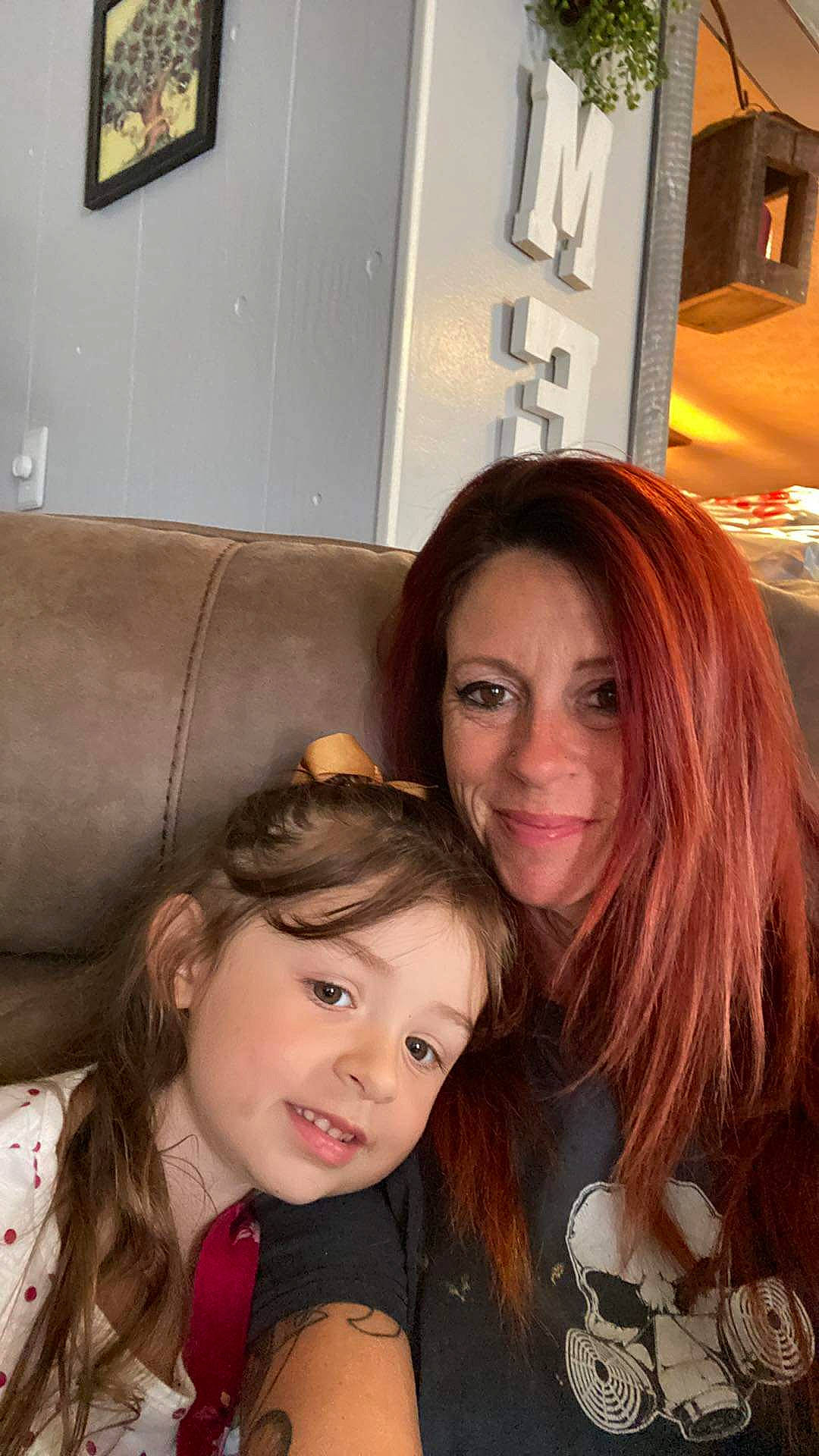 Austin is registered to the contest to win money with this photo: blond, brown_hair, cheek, couch, event, eyebrow, eyelash, fun, happy, iris, joy, layered_hair, lip, long_hair, nose, person, picture_frame, selfie, sitting, skin