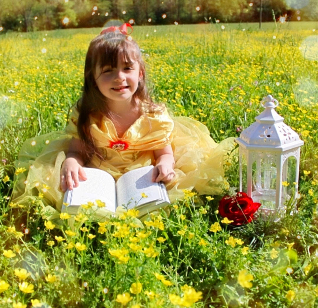 Austin is registered to the contest to win money with this photo: botany, fawn, flower, grass, grass_family, grassland, green, groundcover, happy, joy, landscape, meadow, natural_environment, natural_landscape, people_in_nature, person, petal, plant, prairie, smile