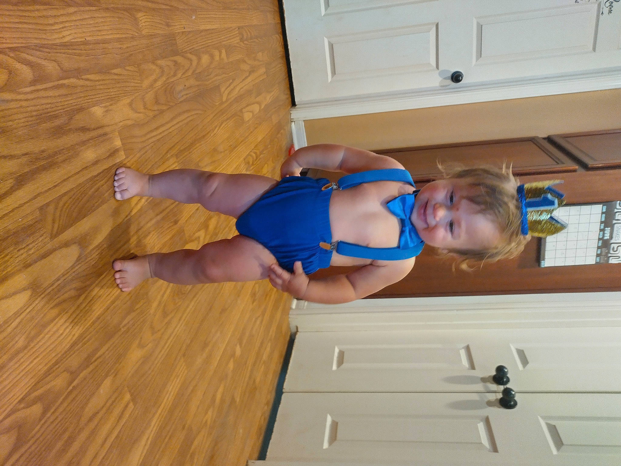 Tristan is registered to the contest to win money with this photo: baby, baby_toddler_clothing, comfort, elbow, electric_blue, floor, flooring, hardwood, human_leg, knee, person, shorts, sportswear, t_shirt, thigh, thumb, toddler, trunk, varnish, wood