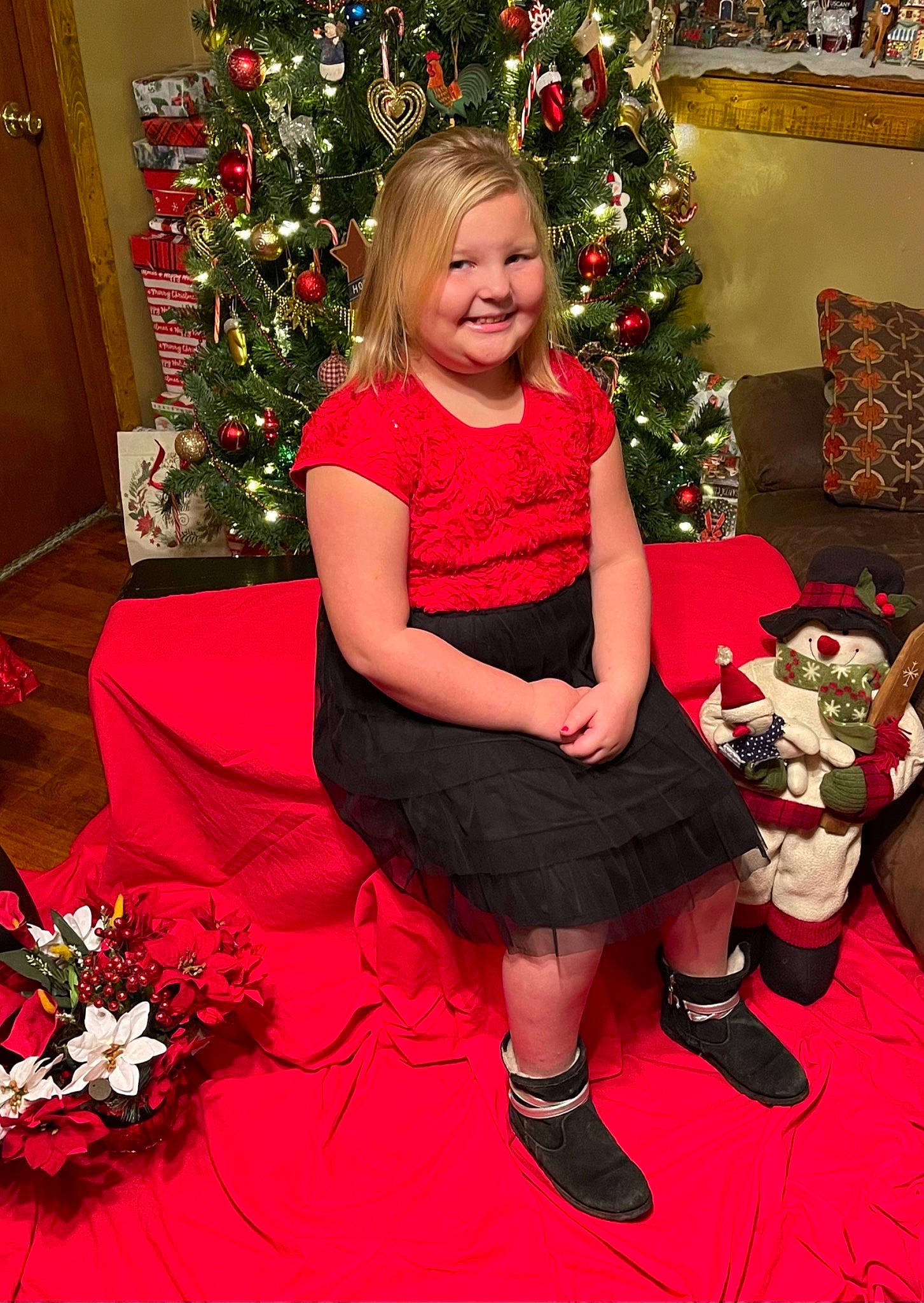 Brooklynn joined the competition — help win amazing prizes! blond, carmine, christmas, christmas_decoration, christmas_eve, christmas_ornament, christmas_tree, dress, event, holiday, holiday_ornament, home, interior_design, joy, lap, ornament, person, red, shoe, sock
