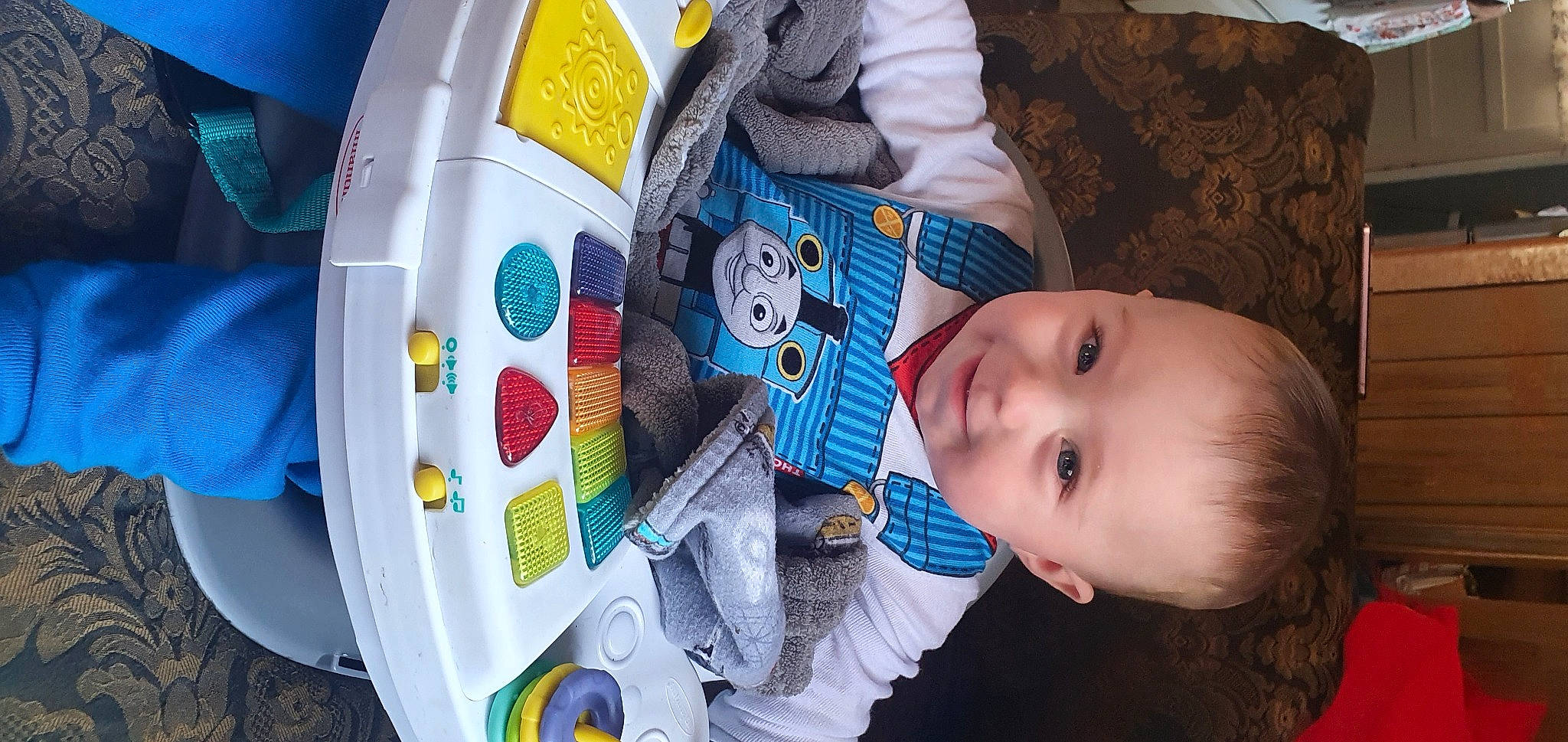 Kingstyn is registered to the contest to win money with this photo: baby, baby_products, baby_toddler_clothing, beauty, blue, cheek, child, fun, happy, mouth, nose, pattern, people, person, plastic, sitting, skin, smile, textile, toddler