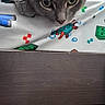 cat, gray_cat, bed, bedding, minecraft_theme, curious, pet, indoor, feline, close_up, animal, resting, looking_down, ears, whiskers, soft_fur, wooden_frame, blanket, room, casual