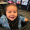 toddler, child, baby, smiling, happy, portrait, face, indoors, restaurant, high_chair, pink_bow, hair, denim_jacket, black_shirt, heart_pattern, seated, drink_cooler, beverages, store, photography