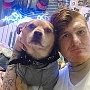Dog joined the competition — help win amazing prizes! bandana, bed, blanket, casual_clothing, decor, dog, expression, face, fan, friendship, head, indoor, music_notes, person, pet, posters, room, selfie, tattoo, wall_art