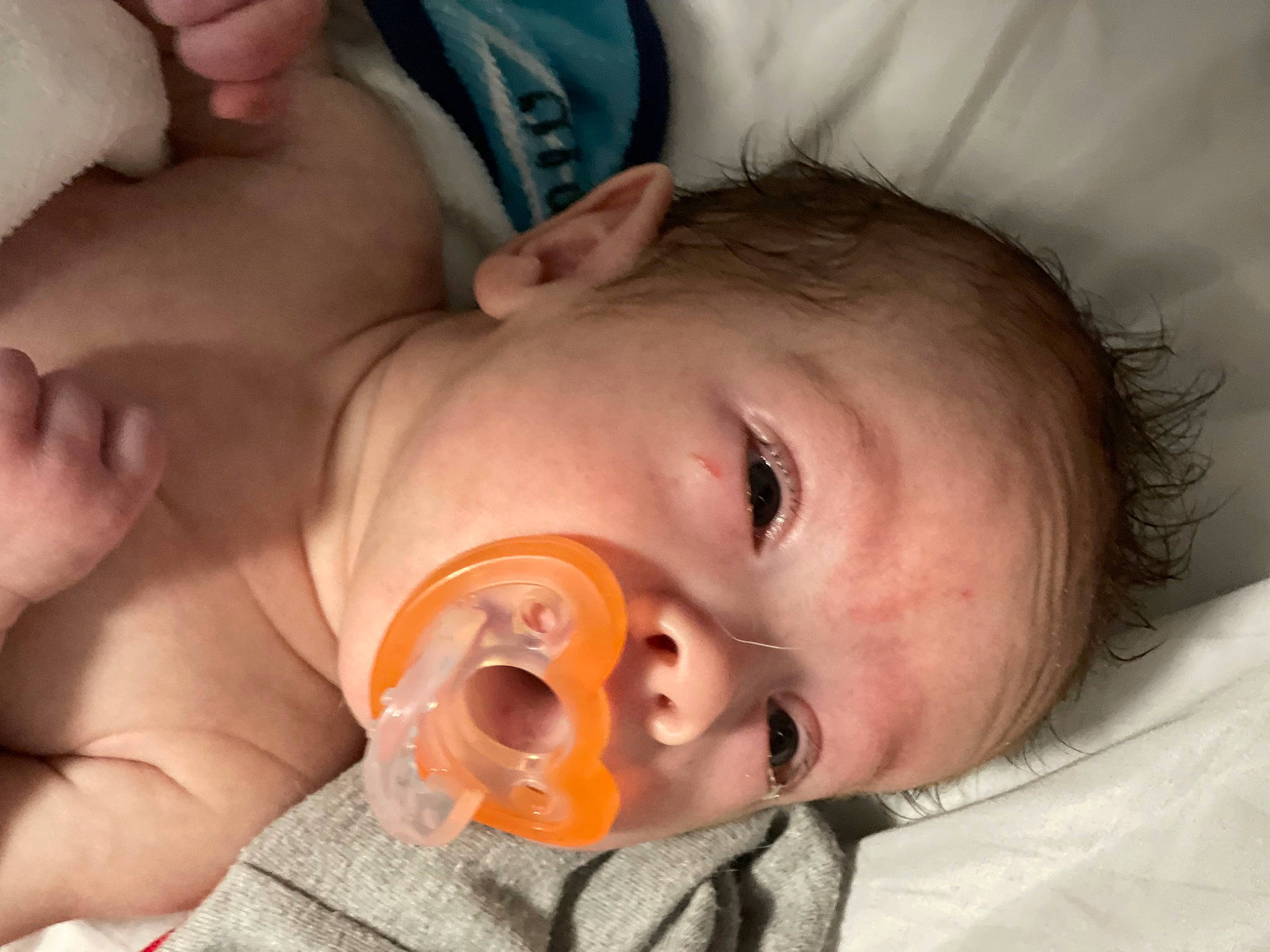 Clark is registered to the contest to win money with this photo: baby, cheek, child, chin, close_up, comfort, ear, eyebrow, eyelash, finger, forehead, head, iris, jaw, lip, mouth, neck, nose, person, skin