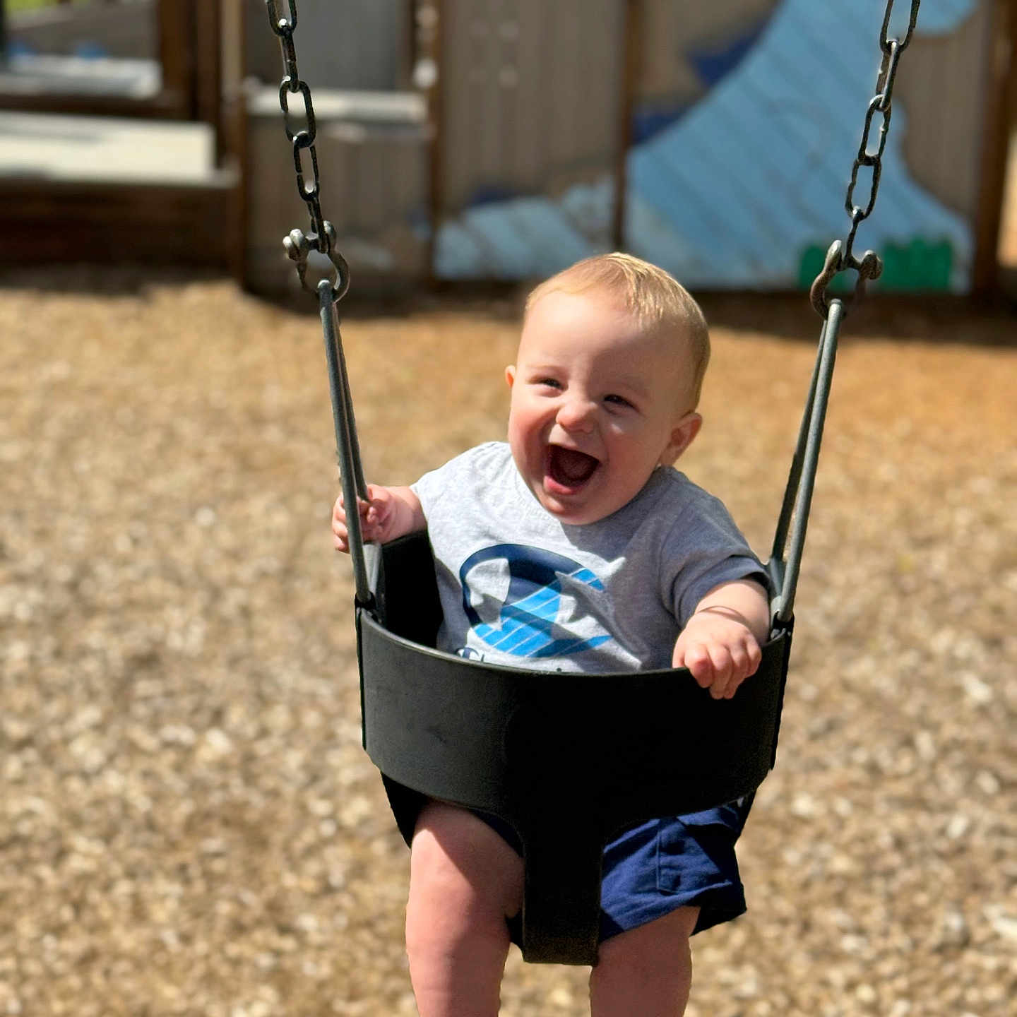 Zayne is registered to the contest to win money with this photo: baby, car, clothing, face, grass, happy, head, nature, outdoorplayarea, outdoors, park, person, photography, plant, playarea, portrait, shorts, toy, transportation, vehicle