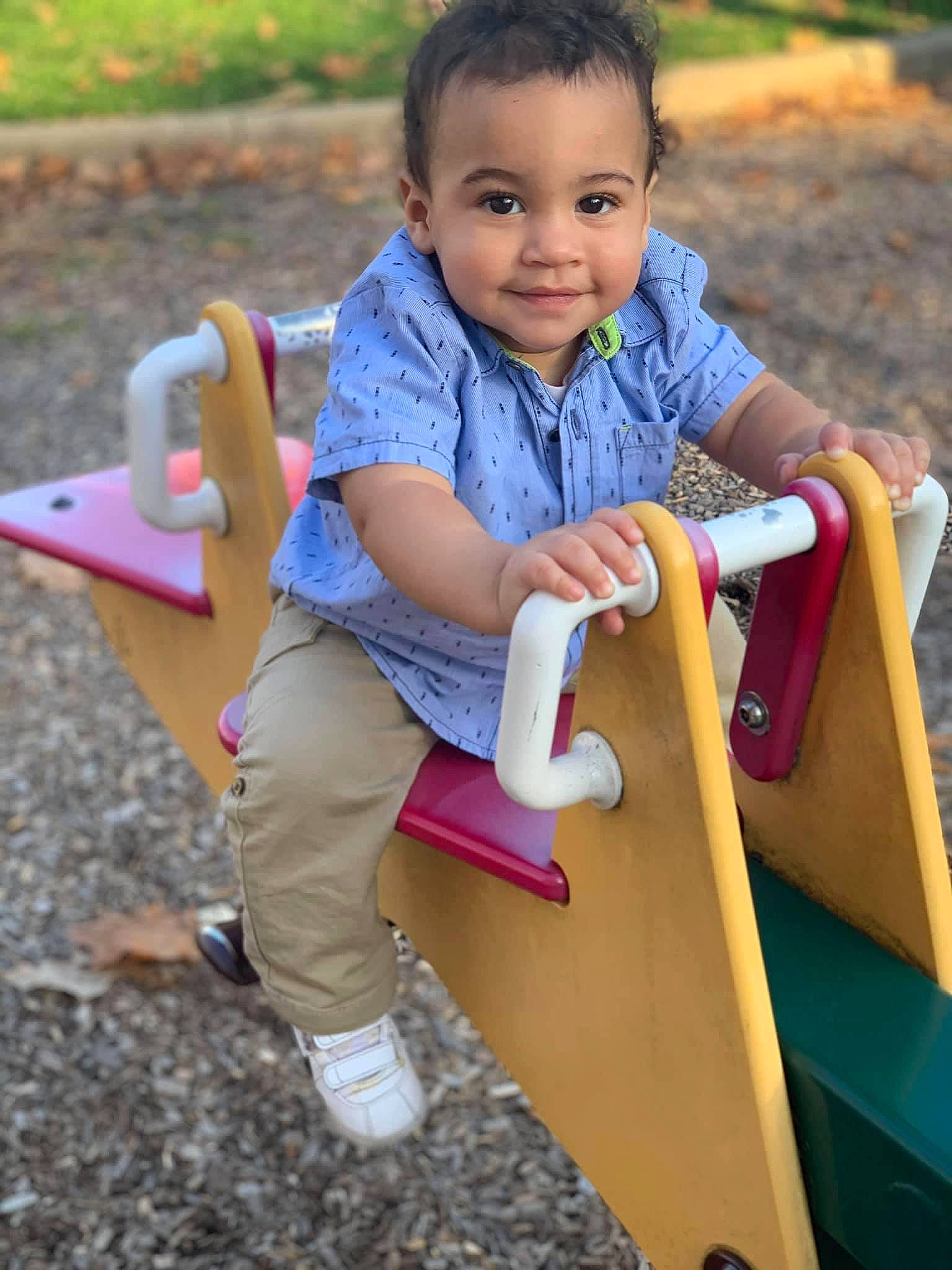 Zander is registered to the contest to win money with this photo: baby, baby_toddler_clothing, balance, child, chute, happy, human_settlement, joy, outdoor_play_equipment, outdoor_recreation, person, pink, play, playground, playground_slide, public_space, riding_toy, sitting, sneakers, summer