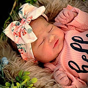 Adalynn is registered to the contest to win money with this photo: newborn, baby, sleeping, basket, fur, greenery, headband, pink_clothing, peaceful, infant, cute, portrait, child, flora, soft_texture, closeup, resting, adorable, cozy, baby_girl