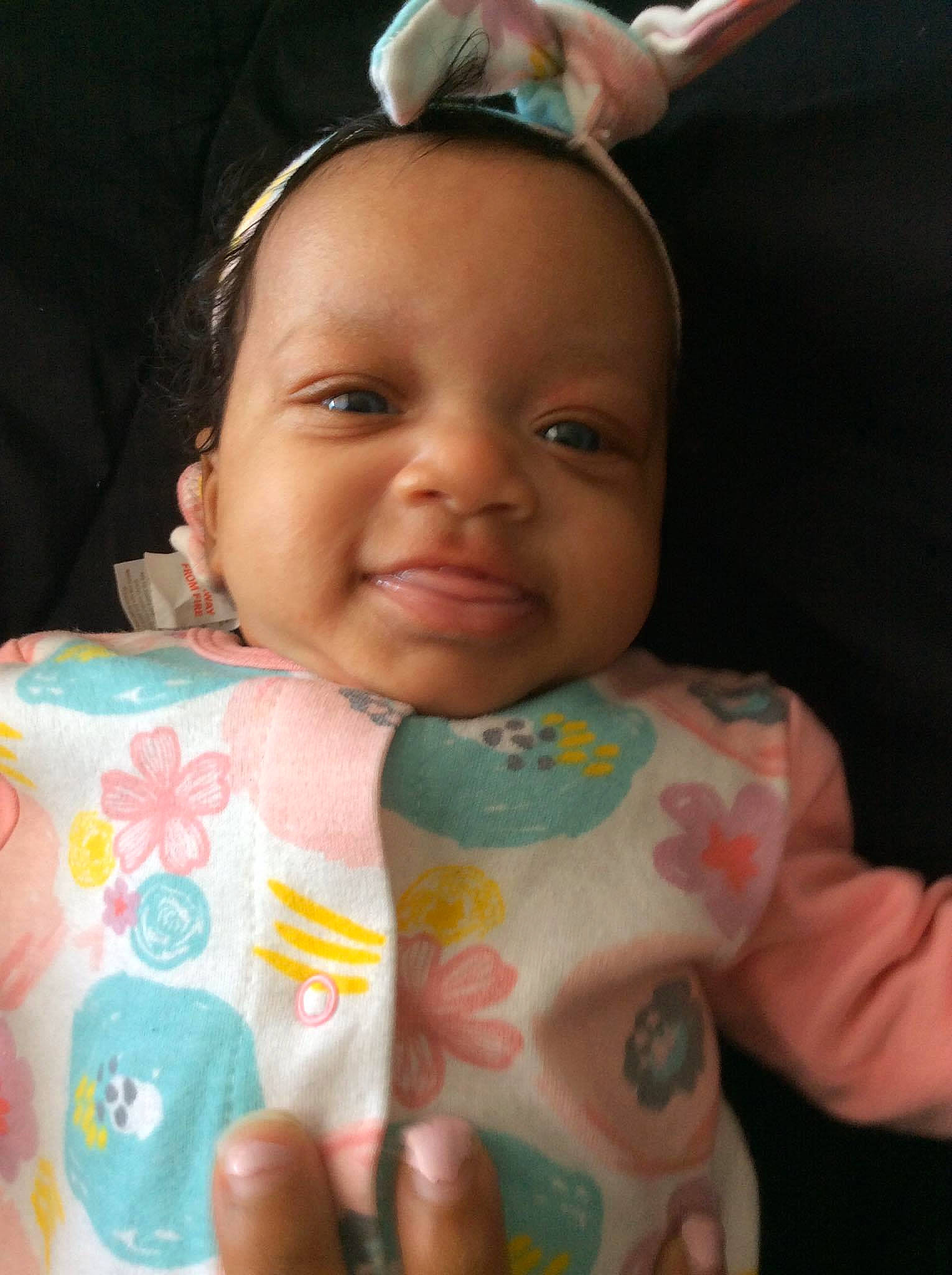 Raina is registered to the contest to win money with this photo: baby, cheek, child, ear, eye, face, finger, forehead, hand, head, iris, joy, lip, mouth, neck, person, skin, smile, toddler