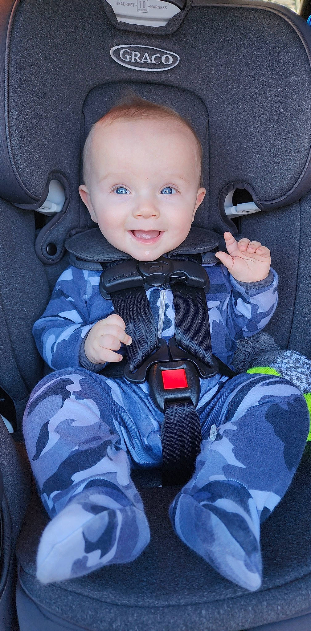 Winston is registered to the contest to win money with this photo: auto_part, baby, baby_carriage, baby_in_car_seat, baby_products, baby_safety, baby_toddler_clothing, car_seat, car_seat_cover, child, comfort, electric_blue, fun, joy, person, product, seat_belt, sitting, smile, steering_wheel