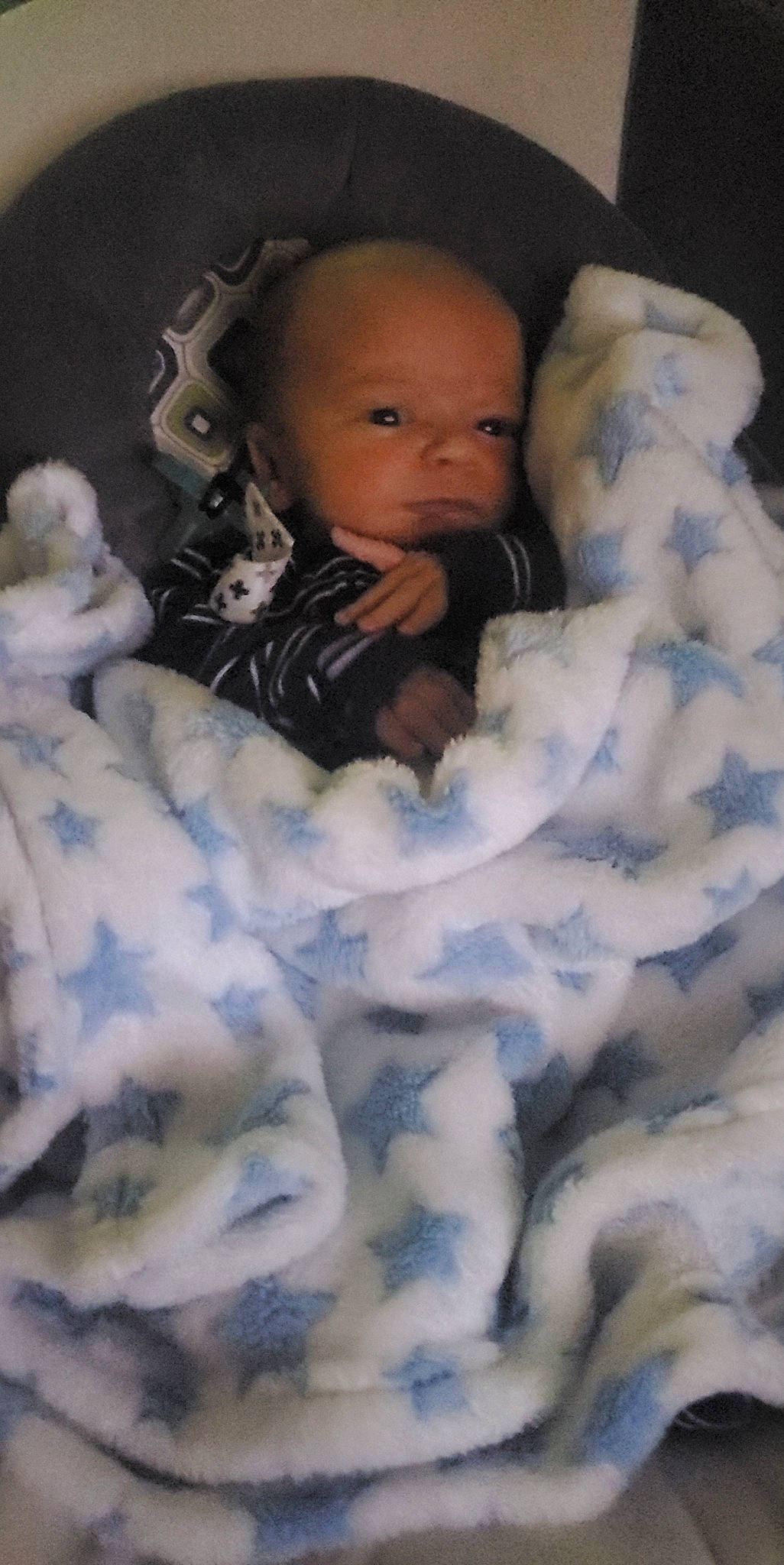 Grayson is registered to the contest to win money with this photo: baby, baby_products, baby_toddler_clothing, bedding, bedtime, child, comfort, facial_expression, flash_photography, fun, fur, happy, linens, pattern, person, portrait_photography, room, sitting, skin, toddler