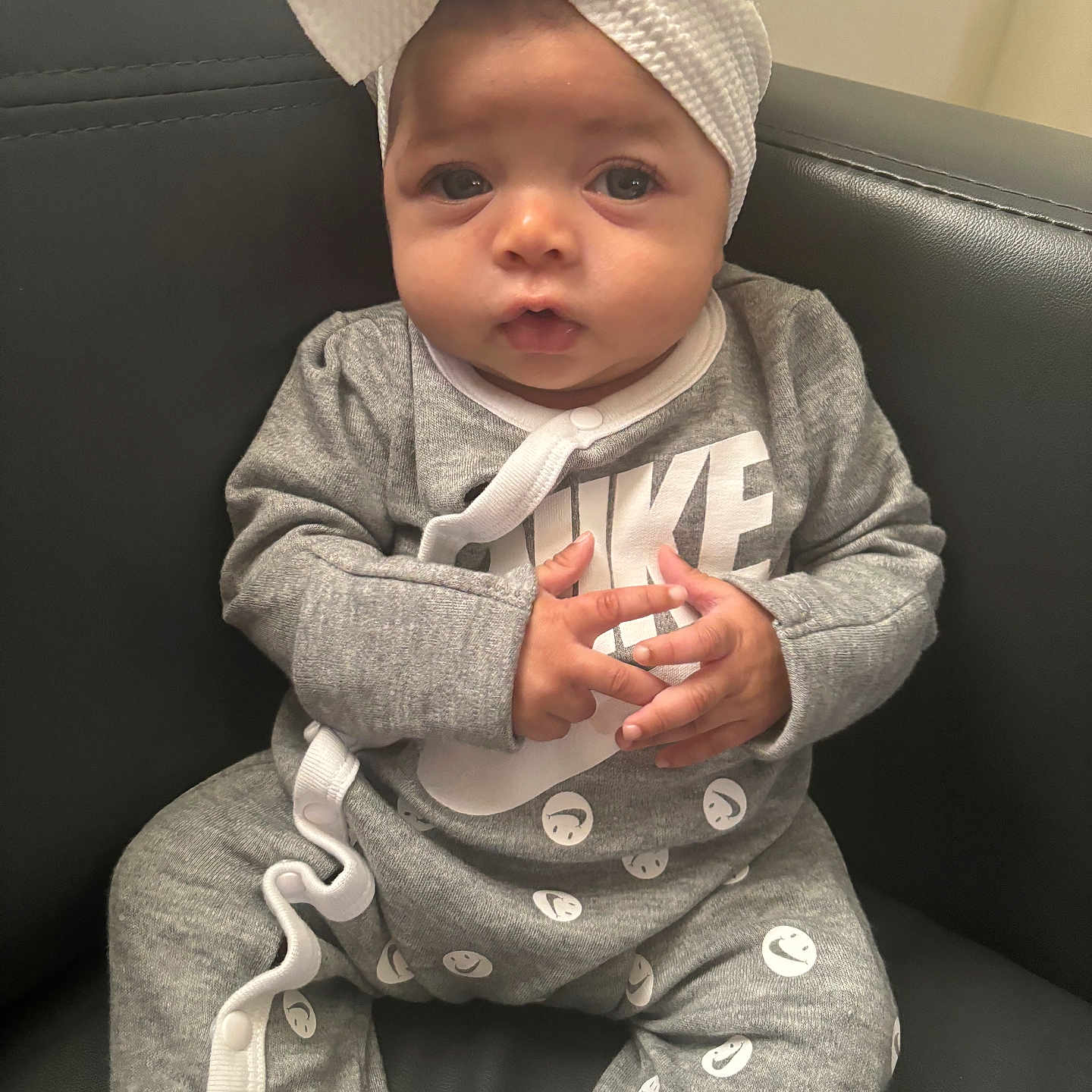 Treslyn joined the competition — help win amazing prizes! baby, bodypart, bonnet, cap, clothing, face, finger, formalwear, hand, happy, hat, head, pajamas, pants, person, photography, portrait, sitting, smile, turban