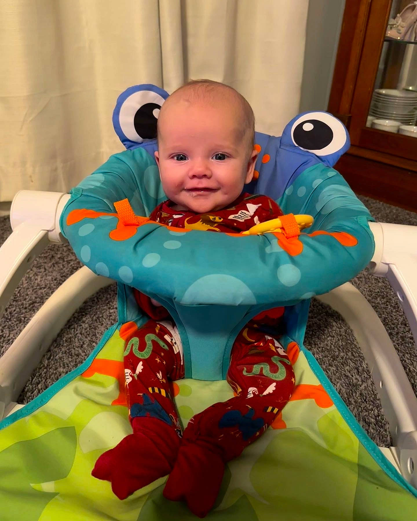 Eleanor is registered to the contest to win money with this photo: azure, baby, baby_products, baby_toddler_clothing, chair, child, comfort, electric_blue, event, face, fictional_character, fun, happy, head, joy, leisure, person, product, room, sitting