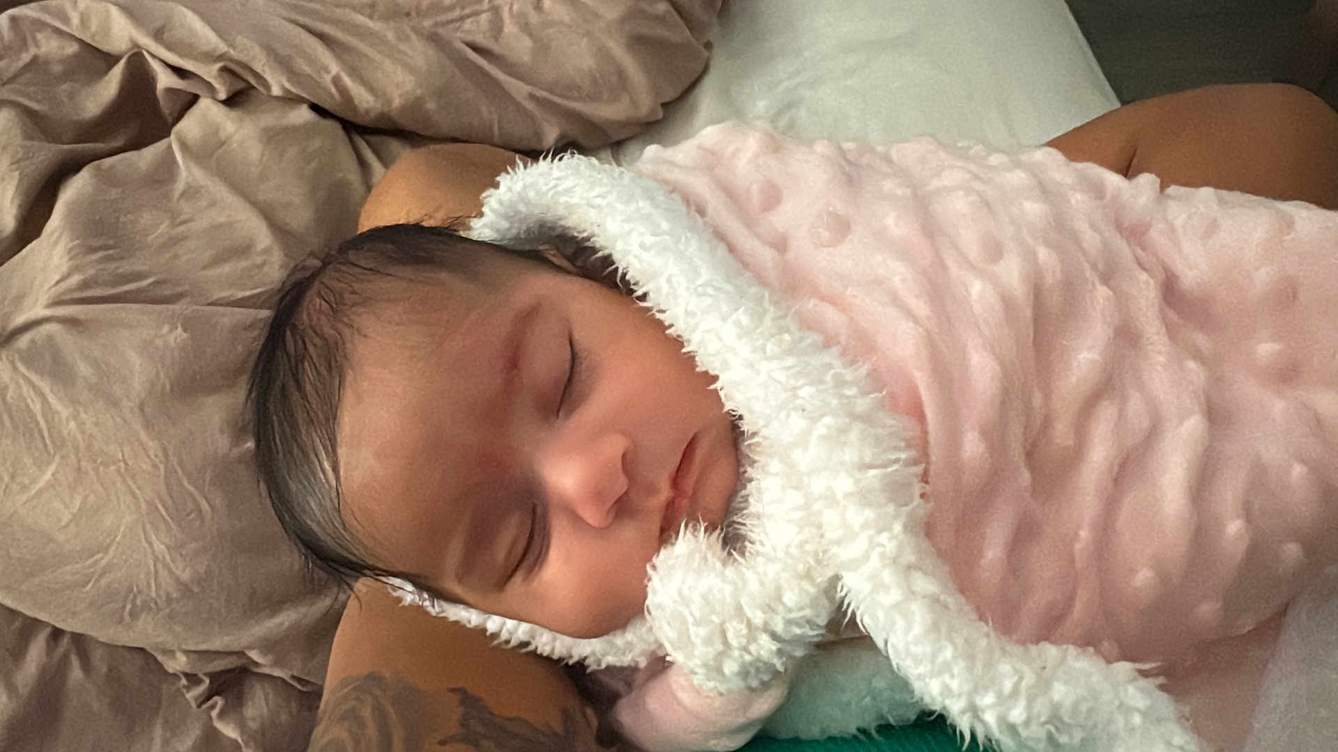 Amiah joined the competition — help win amazing prizes! baby, sleeping, blanket, pink, white, tattoo, arm, bed, bedding, soft, cozy, infant, face, peaceful, rest, person, skin, indoors, comfort, closeup