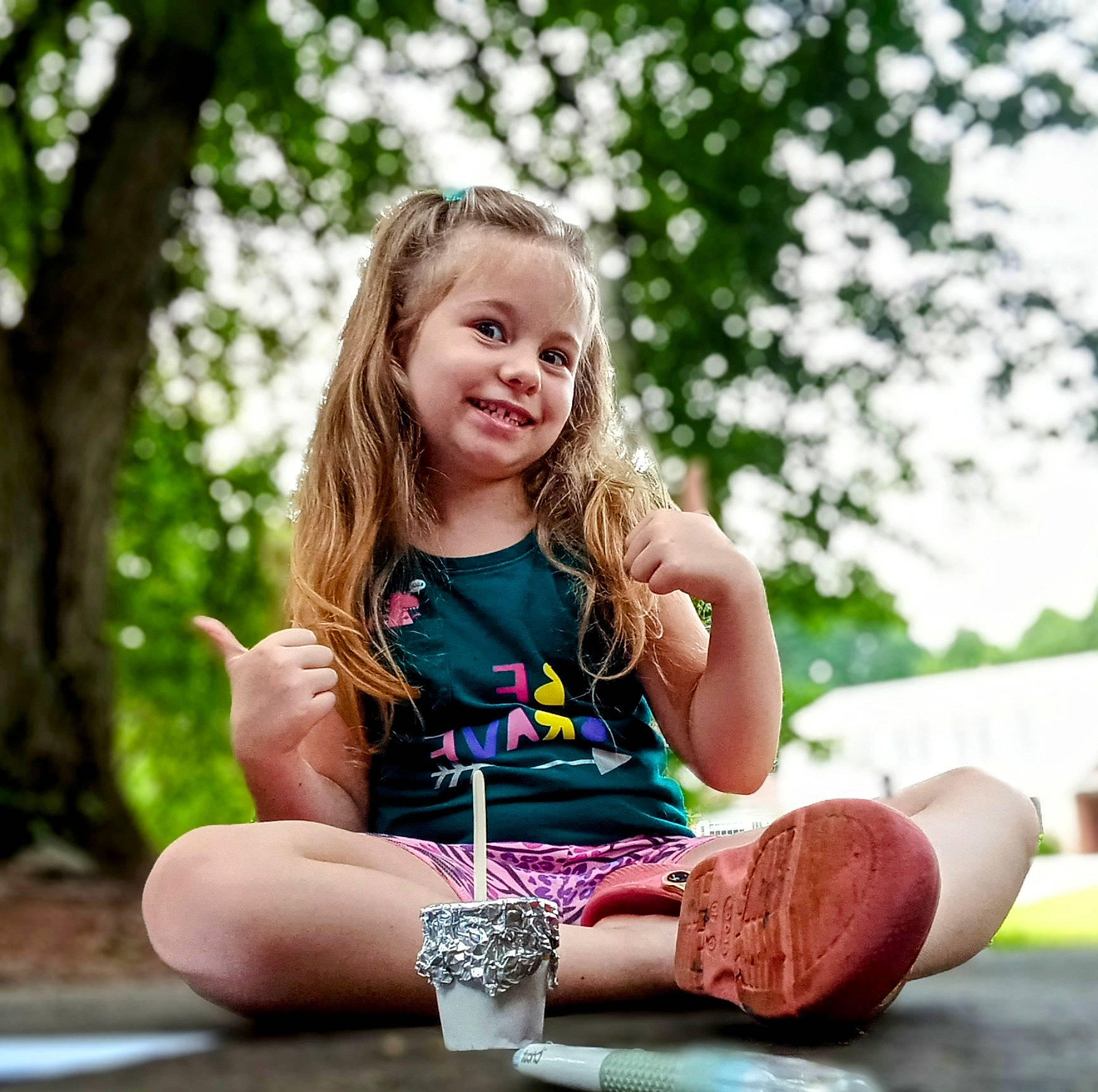 Kinzleigh is registered to the contest to win money with this photo: blond, brown_hair, child, foot, fun, grass, happy, human_leg, joy, knee, leisure, people_in_nature, person, play, recreation, shorts, sitting, smile, sock, thigh