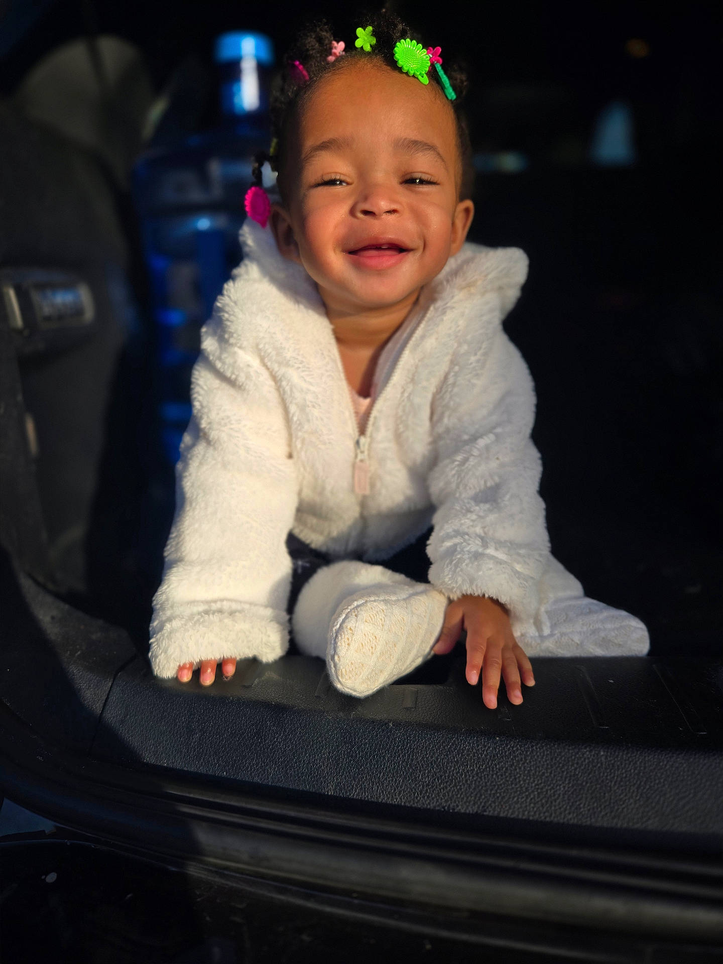 Kahari is registered to the contest to win money with this photo: accessories, baby, babylaughing, bodypart, clothing, coat, face, finger, hand, happy, hat, head, knitwear, laughing, person, photography, portrait, sitting, smile, sweater