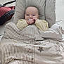 baby, blanket, pacifier, baby_seat, floor, tile, backpack, infant, clothing, cute, comfort, indoor, resting, young_child, sleepwear, striped_blanket, stars, calm, person, soft