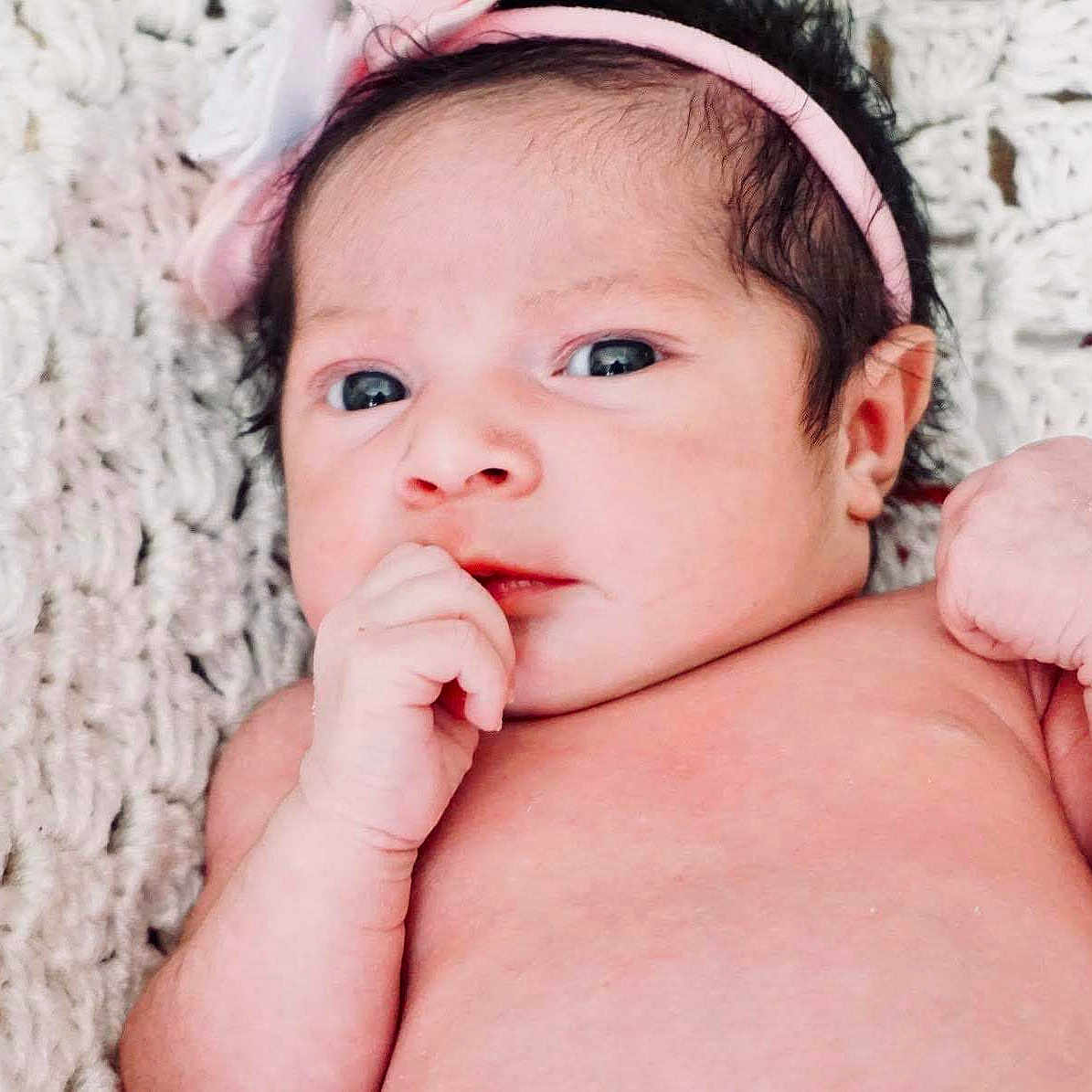 Elia is registered to the contest to win money with this photo: baby, beauty, cheek, child, child_model, close_up, eye, face, hand, head, headgear, lip, muscle, nose, person, photograph, photography, pink, portrait_photography, skin