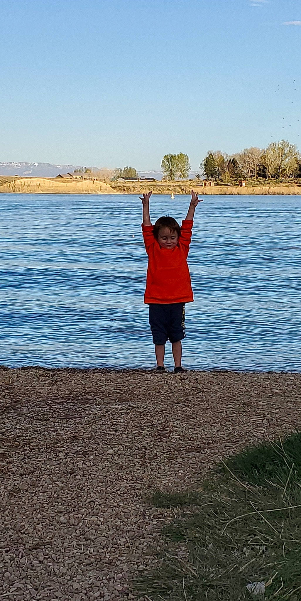 Matthew is registered to the contest to win money with this photo: arm, balance, child, fun, happy, horizon, lake, leisure, ocean, person, river, sea, shore, sky, standing, summer, tree, vacation, water