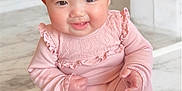 Aliyah joined the competition — help win amazing prizes! baby, cheeks, child, cute, face, footwear, hand, happy, head, indoors, infant, lace, marble_floor, one_person, pink_clothing, portrait, sitting, smiling, soft_lighting, young_child