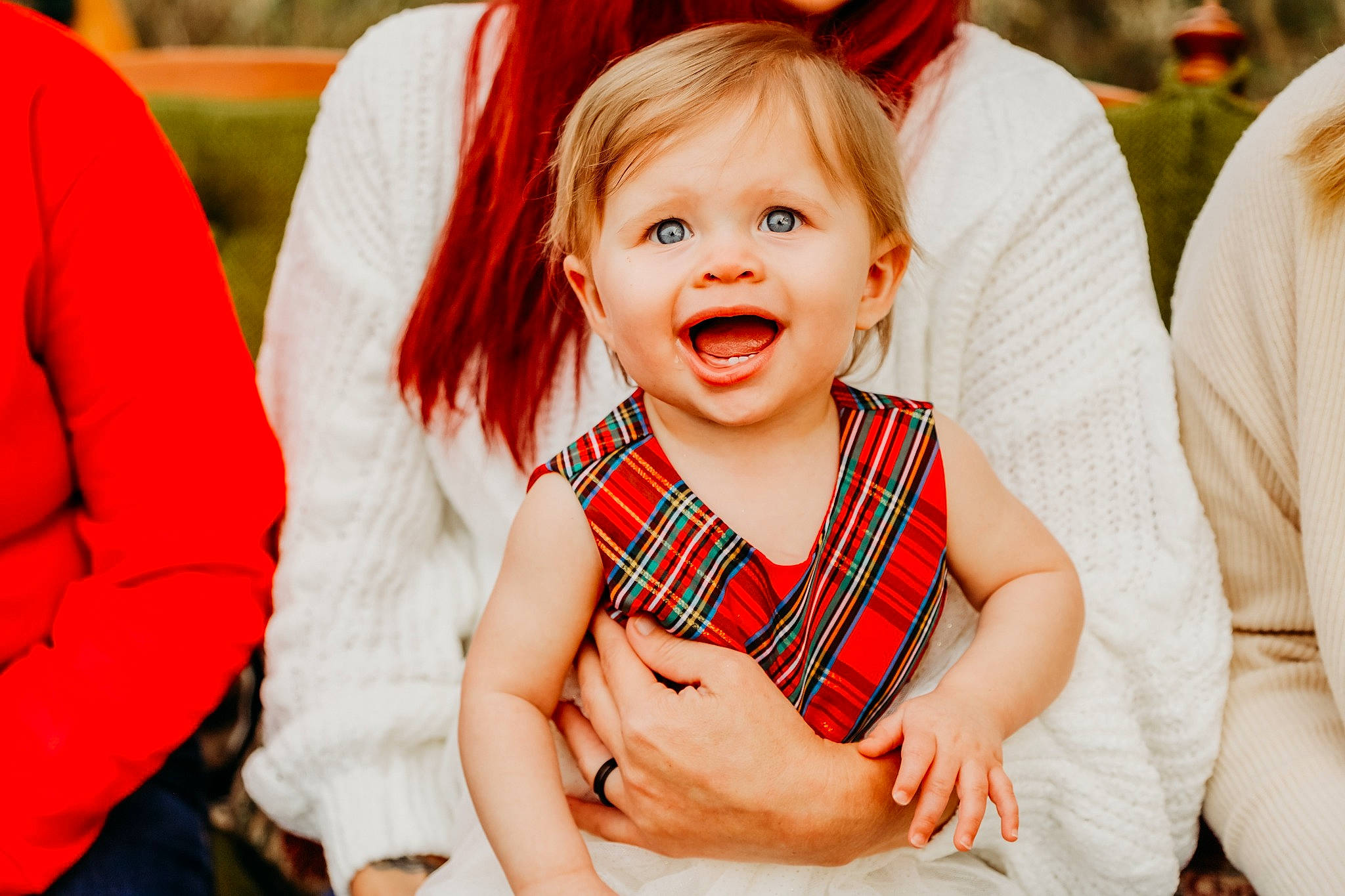 Jacqueline is registered to the contest to win money with this photo: baby, blond, child, dress, event, face, fun, gesture, happy, head, human_body, leisure, orange, person, plaid, recreation, red, skin, sleeve, smile