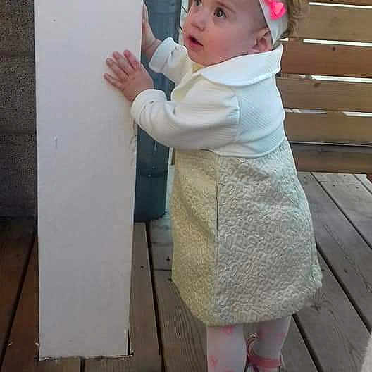 Anna participe au concours pour gagner de l'argent avec cette photo : child, costume, day, floor, girl, headgear, infant, leg, outerwear, person, pink, play, product, skin, standing, textile, toddler