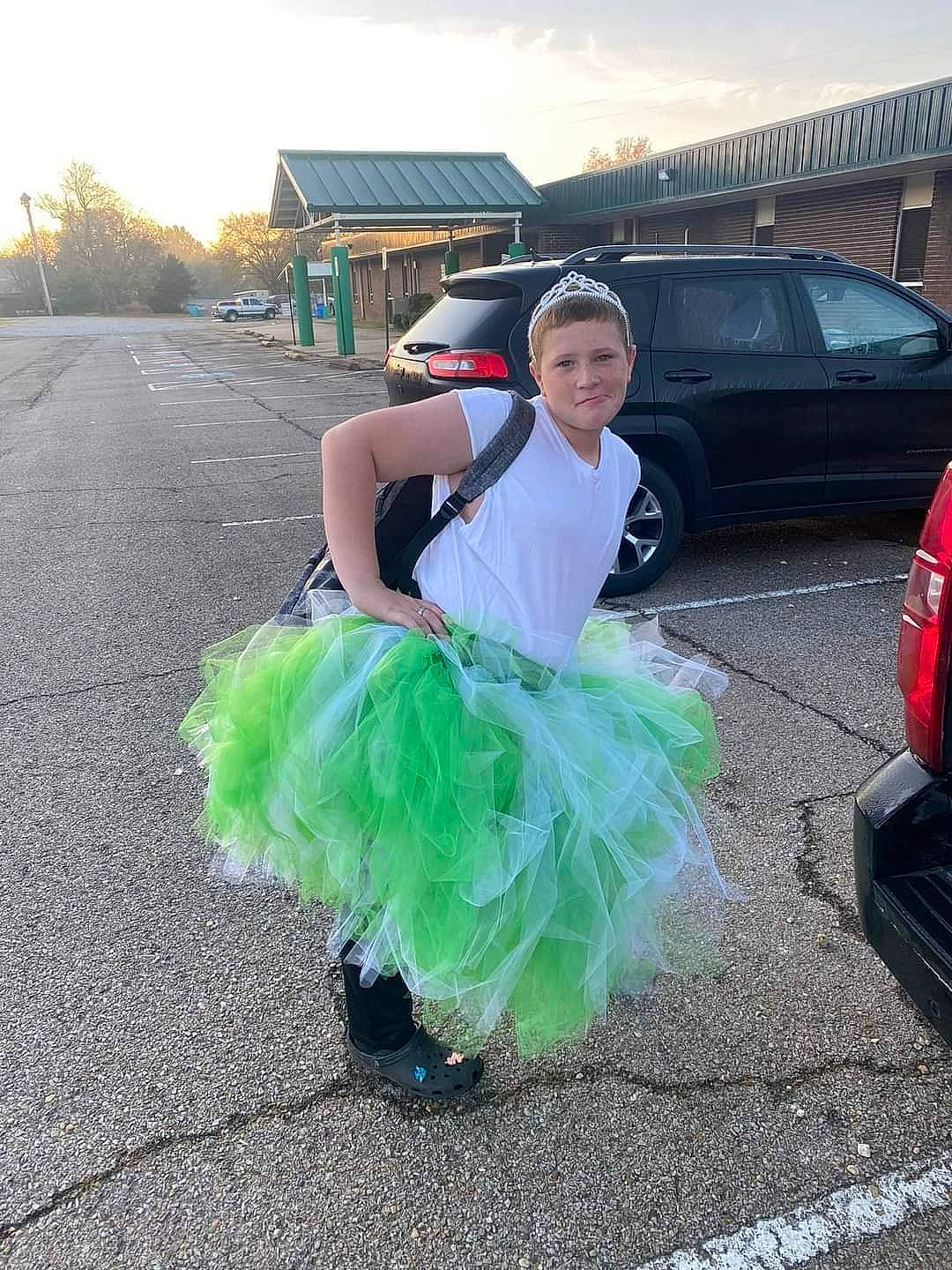 Dakota joined the competition — help win amazing prizes! asphalt, automotive_exterior, bumper, car, electric_blue, event, family_car, fashion_accessory, grass, luxury_vehicle, mid_size_car, motor_vehicle, person, personal_luxury_car, road, sky, smile, tire, vehicle, vehicle_door