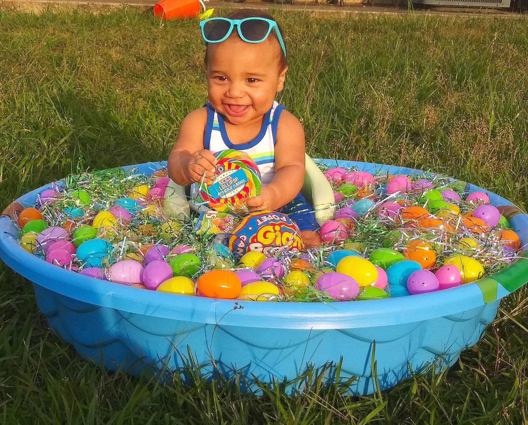 Kristopher is registered to the contest to win money with this photo: child, easter, easter_egg, food, grass, holiday, joy, person, play, toddler