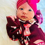 Magnoliah joined the competition — help win amazing prizes! baby, infant, face, headwrap, bow, pink, clothing, pajamas, pattern, holiday, lying_down, fluffy, white_background, cute, portrait, newborn, child, soft_texture, closeup, indoors