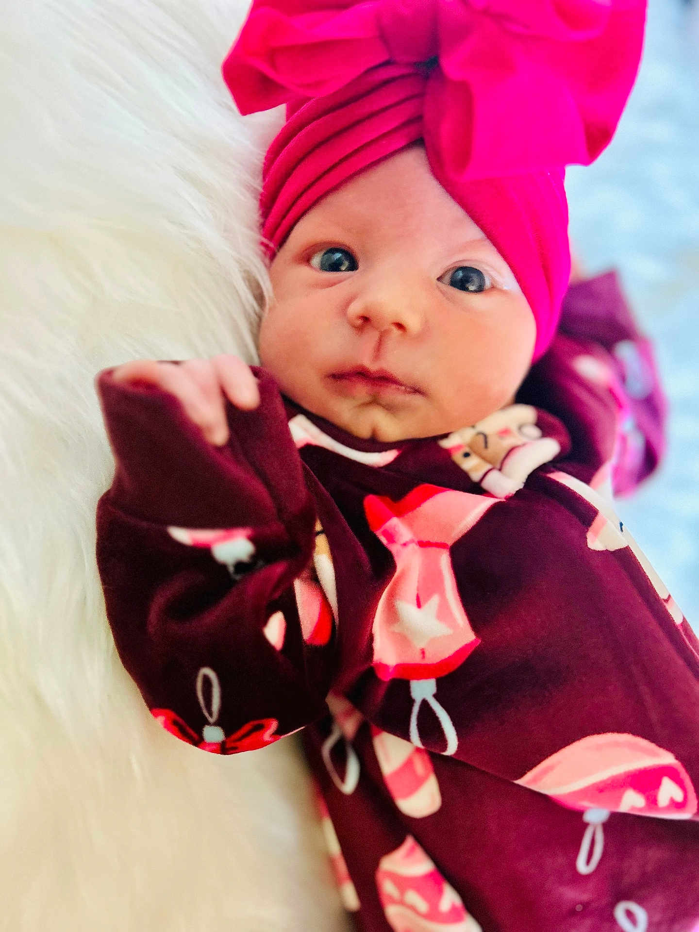 Magnoliah joined the competition — help win amazing prizes! baby, infant, face, headwrap, bow, pink, clothing, pajamas, pattern, holiday, lying_down, fluffy, white_background, cute, portrait, newborn, child, soft_texture, closeup, indoors