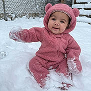 Kalilah joined the competition — help win amazing prizes! baby, child, clothing, cold, cute, face, fence, frozen, fuzzy, happy, hood, outdoor, pink_onesie, playful, sitting, smiling, snow, snowball, stairs, winter