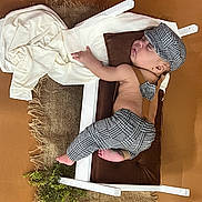 Nathan joined the competition — help win amazing prizes! baby, bed, blanket, bonnet, cap, clothing, crib, cushion, face, furniture, hat, head, homedecor, newborn, pants, person, photography, portrait, sleeping, sunhat
