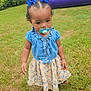 blue_bows, bounce_house, child, curly_hair, daytime, dress, floral_pattern, fun, grass, greenery, nature, outdoor, pacifier, play, playground, portrait, sandals, summer, toddler, young_child