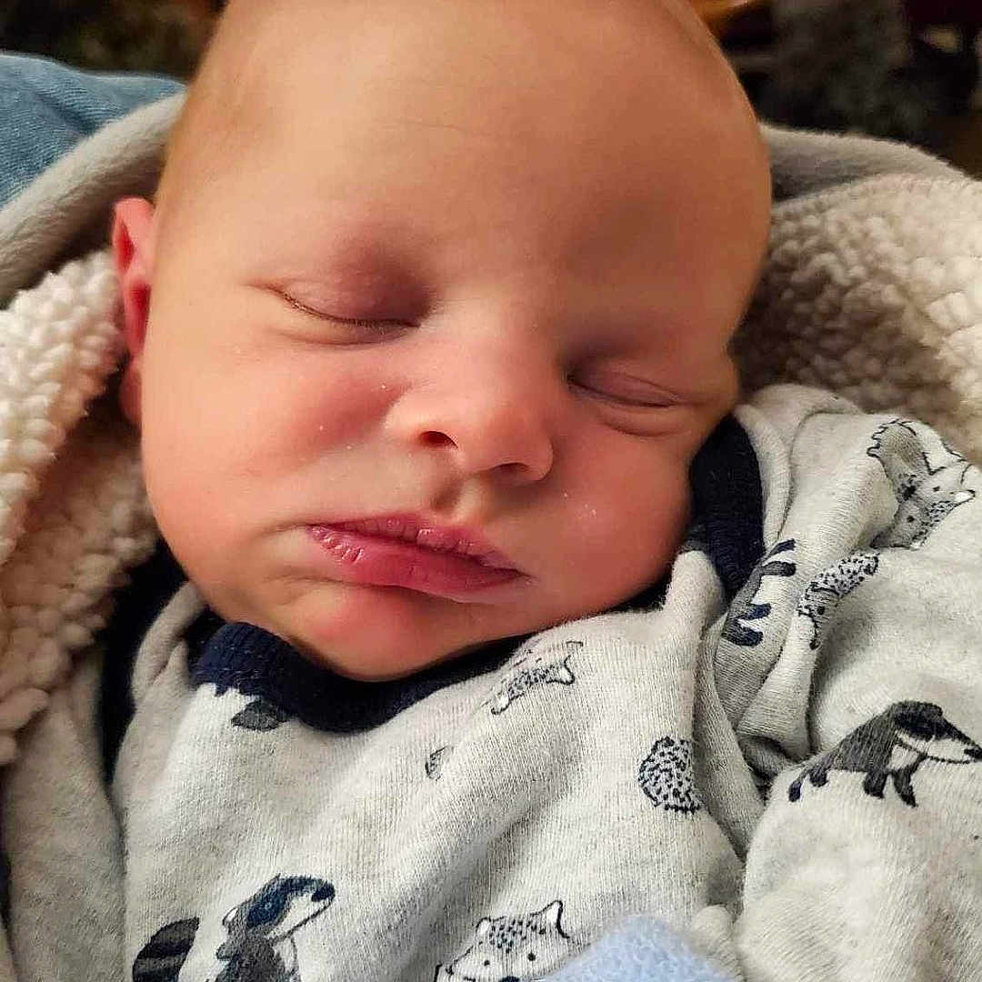 Christopher joined the competition — help win amazing prizes! architecture, baby, bed, bedroom, blanket, building, clothing, couch, cushion, face, furniture, glove, happy, head, homedecor, hospital, indoors, knitwear, newborn, person