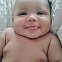 Lamont joined the competition — help win amazing prizes! baby, smiling, tongue_out, cheeks, bare_chest, infant, cute, skin, face, head, lying_down, blanket, texture, soft, young_child, happy, chubby, closeup, portrait, indoors