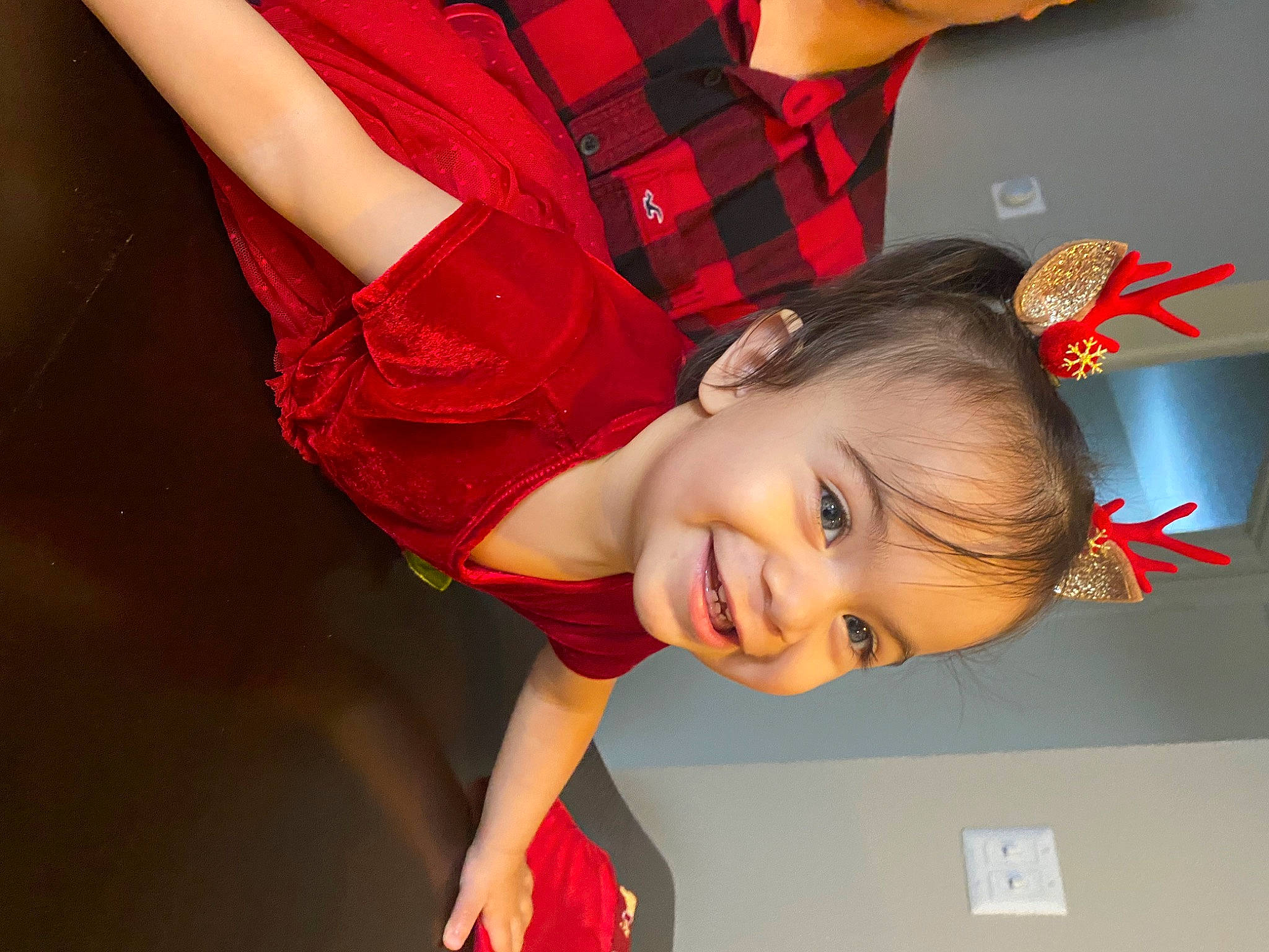 Alyson is registered to the contest to win money with this photo: brown_hair, carmine, child, elbow, fashion_accessory, flash_photography, flooring, fun, gesture, happy, human_leg, joint, joy, lip, pattern, person, plaid, red, sleeve, smile