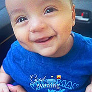 Brandon is registered to the contest to win money with this photo: baby, child, smiling, face, blue_shirt, hand, car_interior, person, cute, portrait, happy, young_child, sitting, human, skin, eyes, expression, clothing, infant, holding