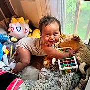 Ryp joined the competition — help win amazing prizes! baby, child, smiling, toys, stuffed_animals, playpen, indoor, happy, crawling, striped_onesie, blanket, window, colorful, plush, cute, infant, soft_toys, playtime, cozy, person