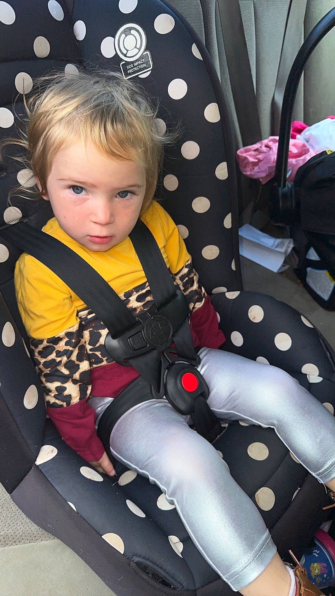 Roselynn joined the competition — help win amazing prizes! auto_part, baby_toddler_clothing, black, blond, car_seat, chair, comfort, cool, fun, hairstyle, human_leg, knee, lap, leg, pattern, person, sitting, steering_wheel, thigh, toddler