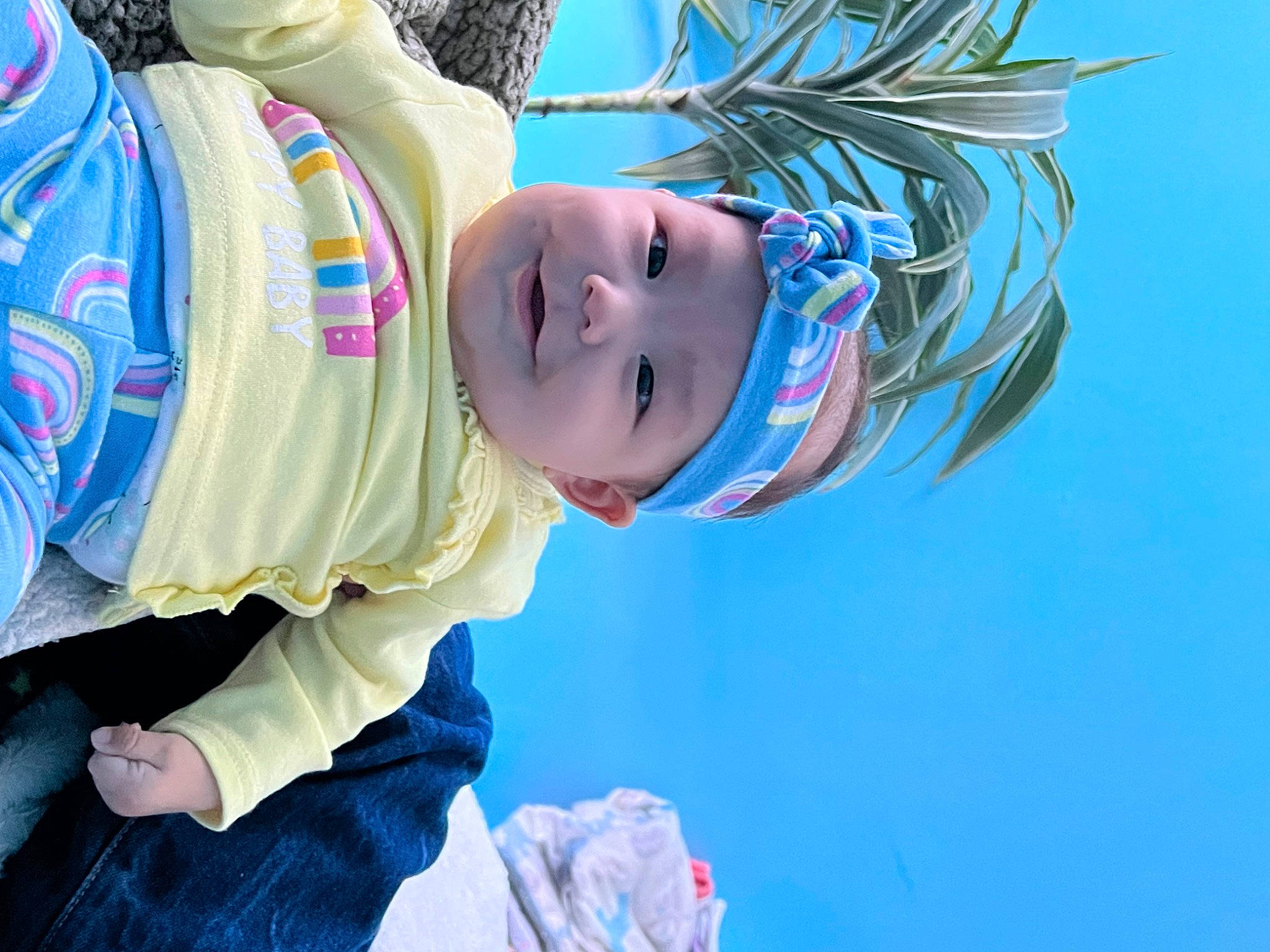 Scarlett is registered to the contest to win money with this photo: baby, blue, child, cool, electric_blue, fashion_accessory, freezing, fun, happy, hat, headwear, human_body, leisure, person, personal_protective_equipment, plant, recreation, smile, toddler, tree