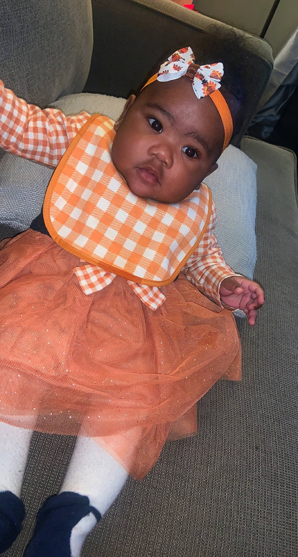 Cevyn joined the competition — help win amazing prizes! baby, baby_products, baby_toddler_clothing, cheek, child, comfort, dress, event, flooring, head, headwear, human_leg, orange, pattern, person, pink, sitting, skin, sleeve, sock