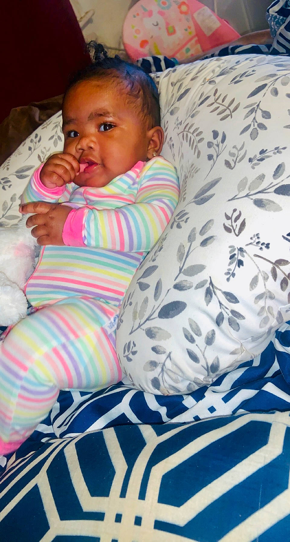 Cevyn is registered to the contest to win money with this photo: baby, baby_toddler_clothing, blue, cheek, child, comfort, couch, electric_blue, eye, head, iris, linens, pattern, people, person, room, sitting, skin, sleeve, textile