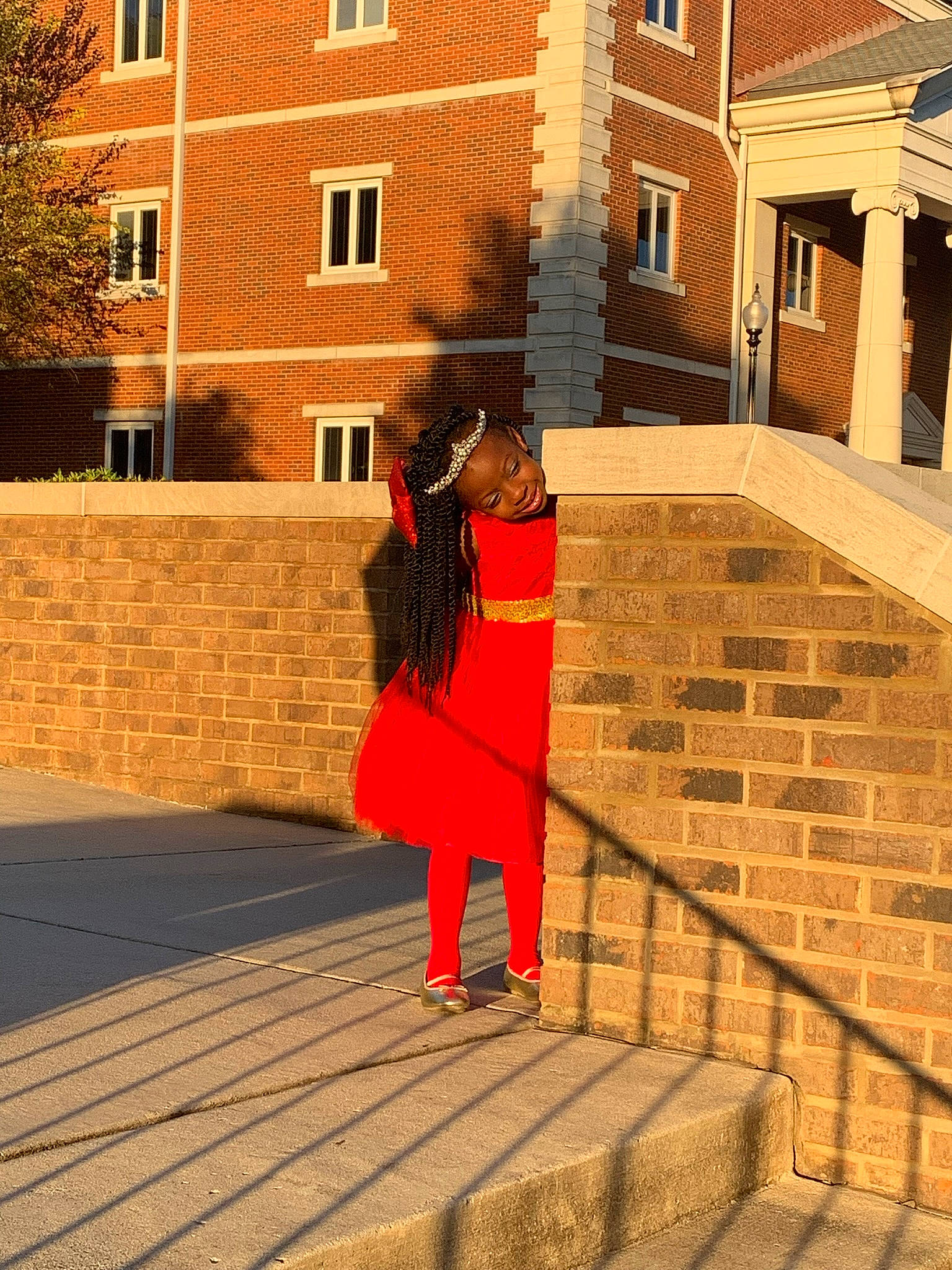 Jatori is registered to the contest to win money with this photo: bag, brick, brickwork, building, city, cobblestone, facade, flooring, human_leg, leisure, luggage_and_bags, orange, person, road_surface, roof, street_fashion, tints_and_shades, travel, tree, window