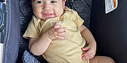 Ida-Belle is registered to the contest to win money with this photo: baby, smiling, infant, onesie, stroller, cushion, child, cute, happy, hand, foot, clothing, fabric, portrait, indoor, skin, face, hair, seat, comfort
