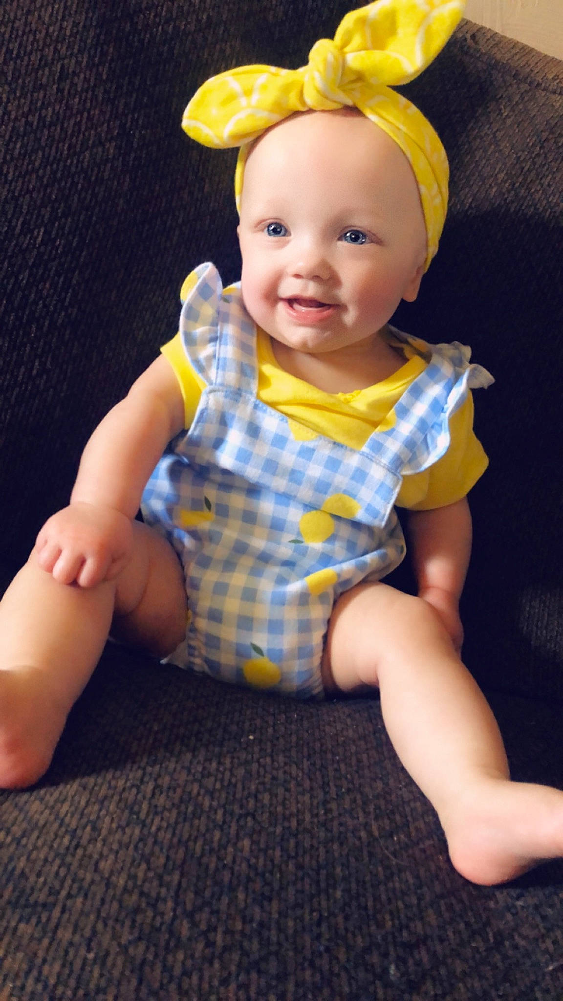Izabella joined the competition — help win amazing prizes! baby, baby_toddler_clothing, cap, cheek, child, hat, head, headgear, joy, pattern, person, play, sitting, skin, sleeve, toddler, toy, yellow